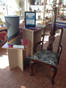 “Mandinka Stool” by artist Blaise Kielar and “Chair-lo” by Edmund Daugherty—two of the works-in-progress chairs that will be displayed and auctioned at the March 5th.