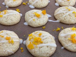 austrian cookies with white icing and orange zest